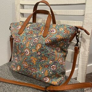 Canvas tote bag purse with vintage floral design and brown handles and straps